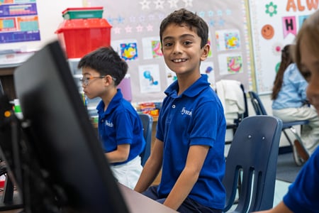 Smiling Nysmith School student looking directly at the camera