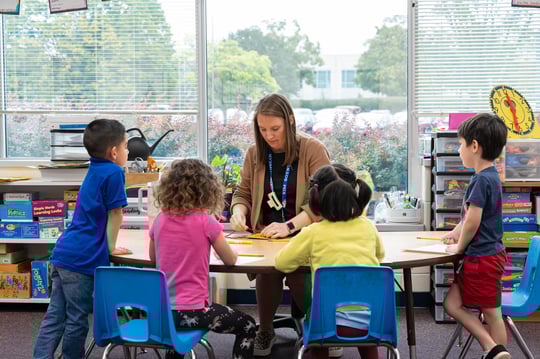 Preschool Teacher working with students